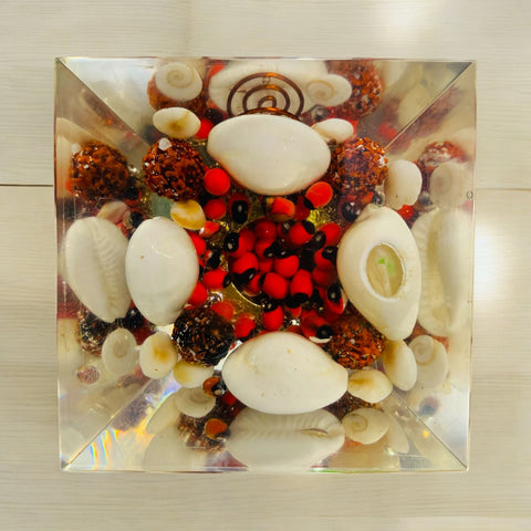The Crystal Laxmi Pyramid With Shree Yantra, Gomti Chakra, Rudraksha, Chirmi & Kaudi Shells. The Crystal Laxmi Pyramid With Shree Yantra, Gomti Chakra, Rudraksha, Chirmi & Kaudi Shells.